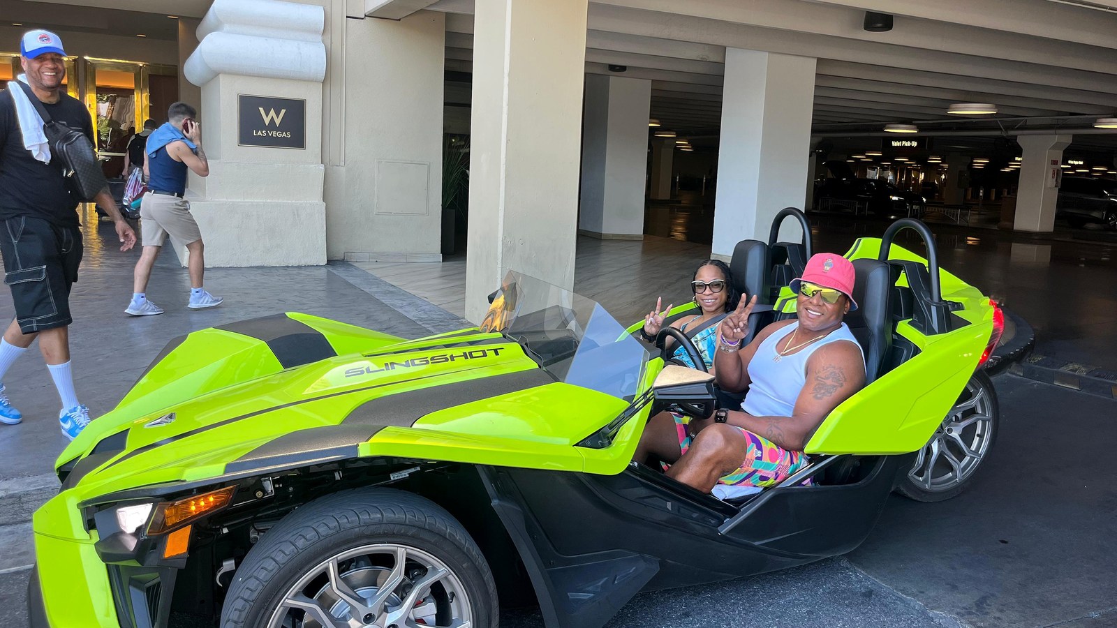 A real customer photo from the old site's gallery - a lime green Polaris Slingshot at the W Las Vegas hotel