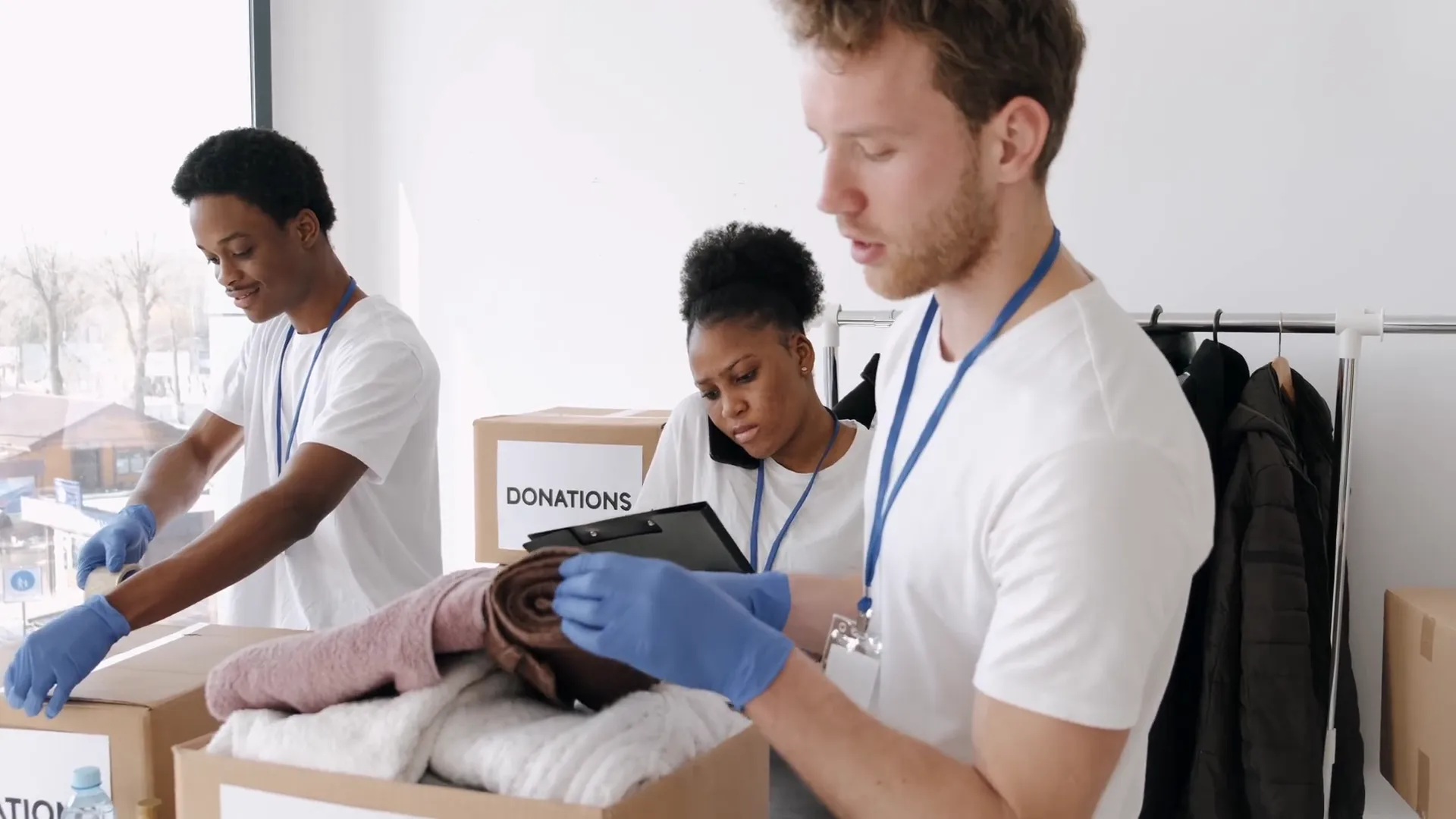 Giving Back - real welcome-kit photo paired with licensed video